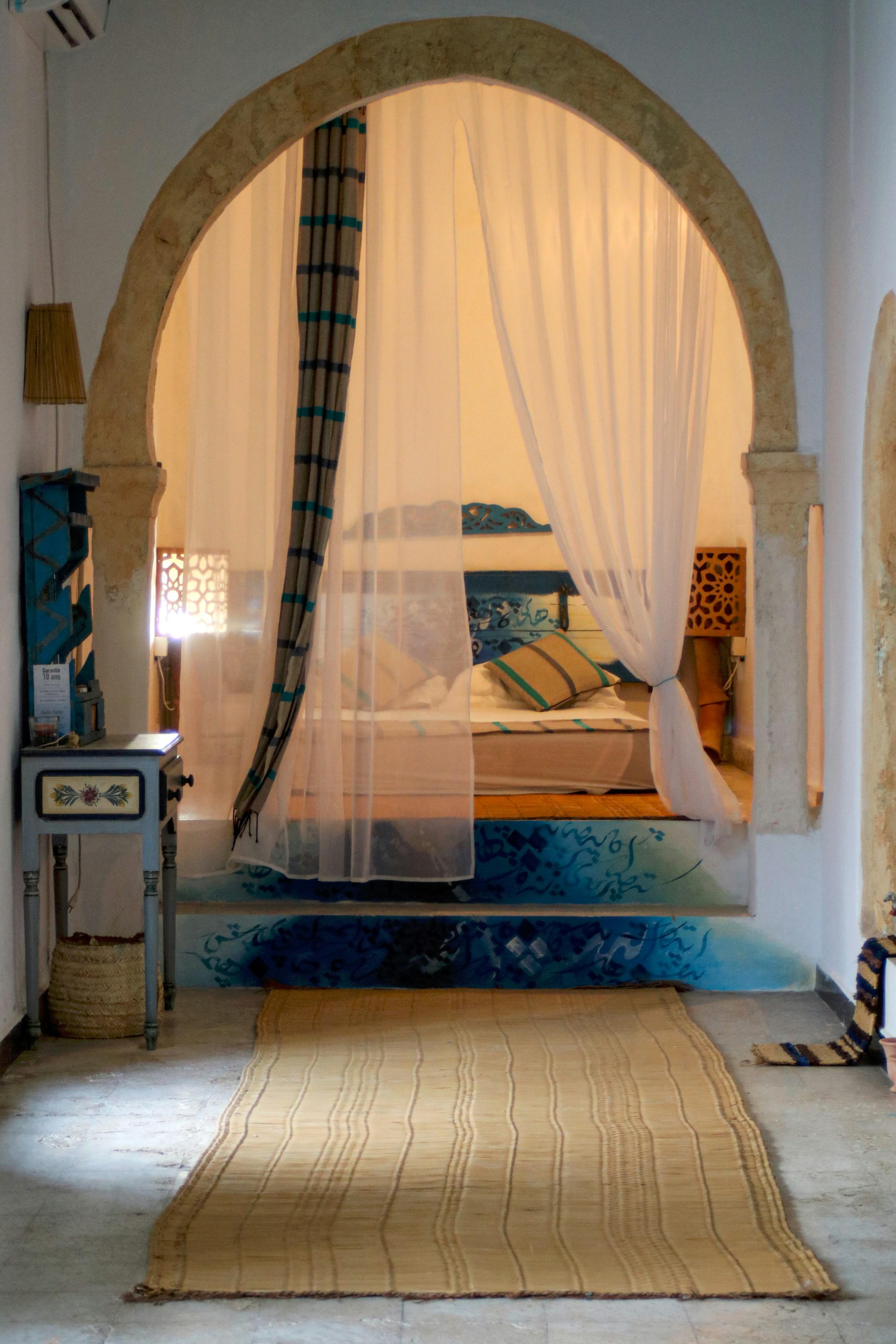 Courtyard room with carved cedar headboard